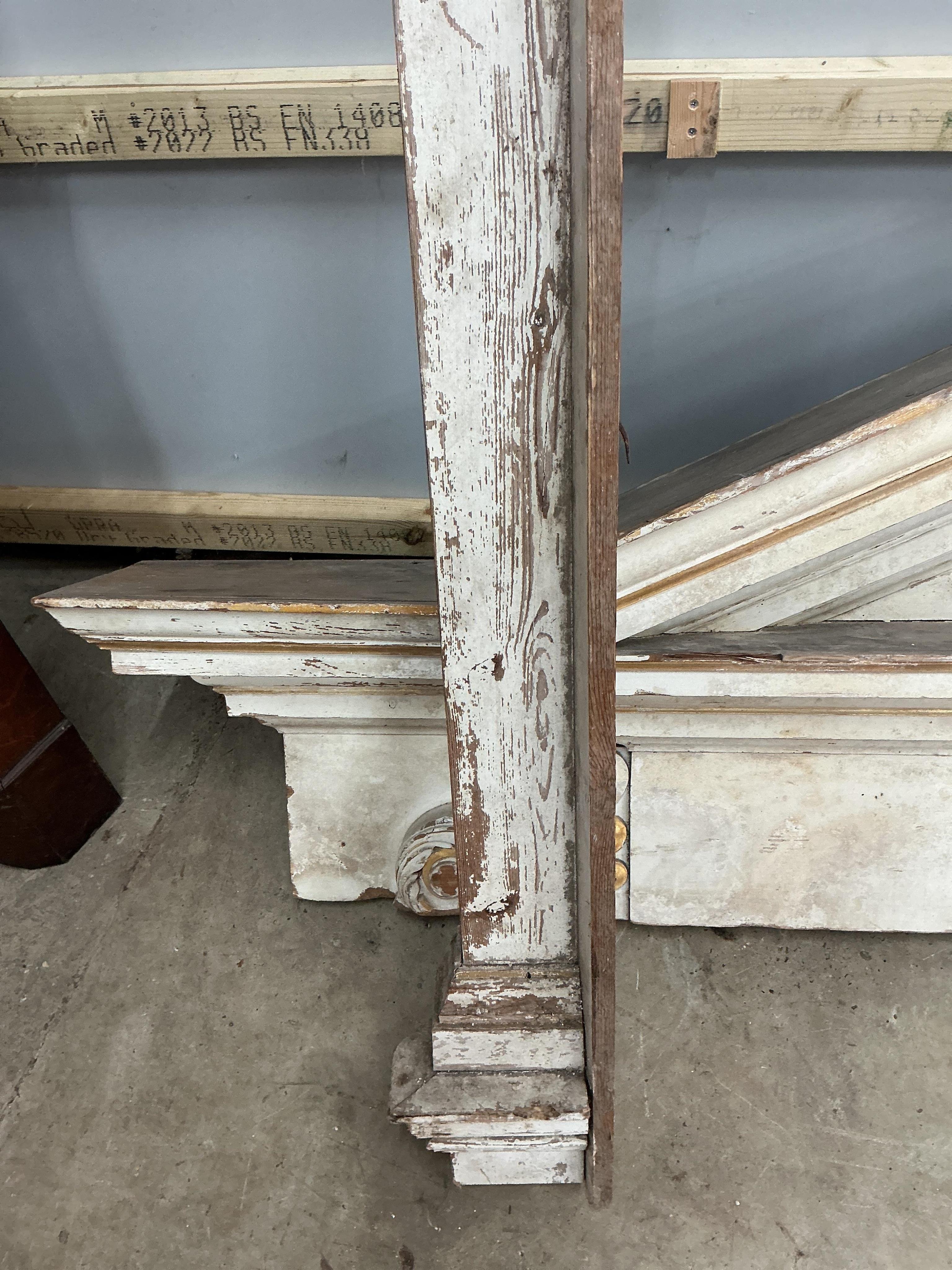 A large late 18th century painted parcel gilt pine door surround, width 154cm, height approximately 266cm